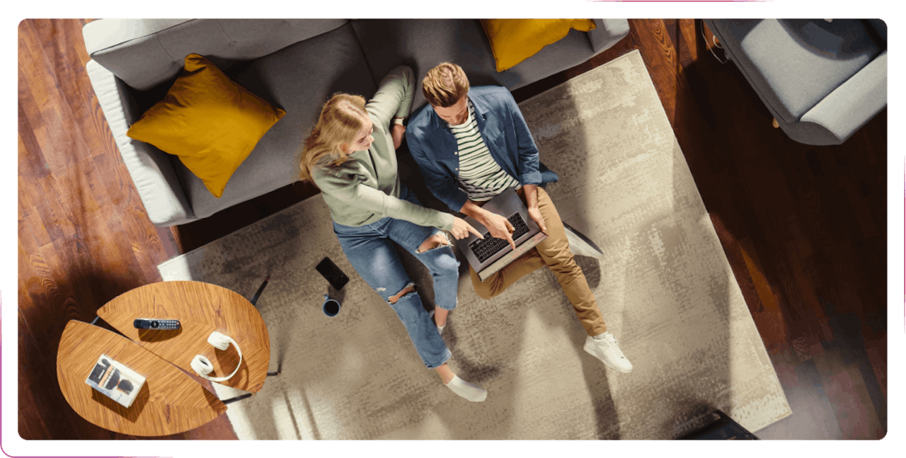 young couple using a laptop