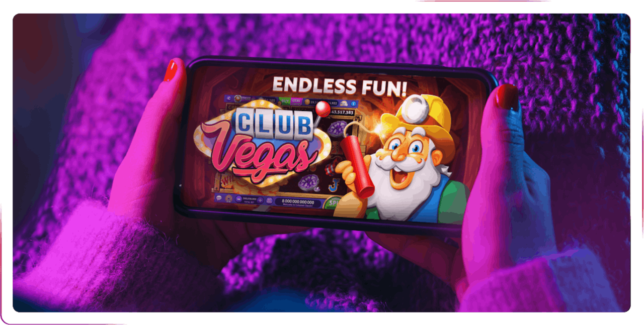 view of hands playing game on mobile phone
