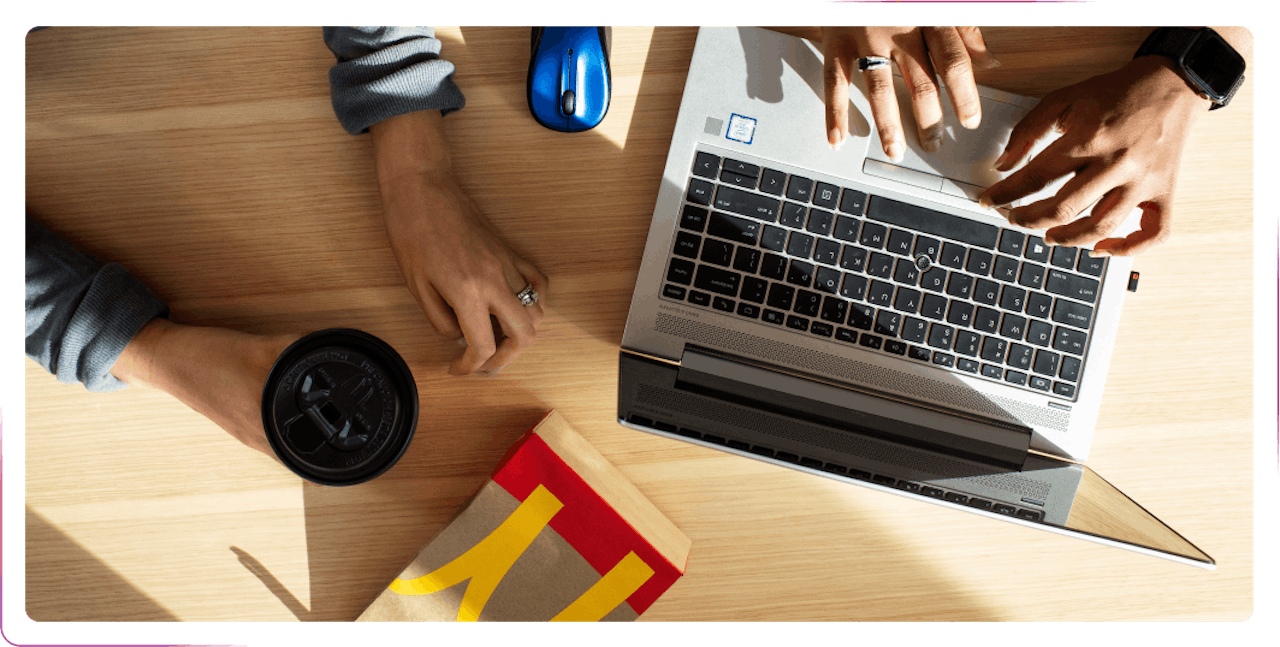 working on the laptop with food and coffee